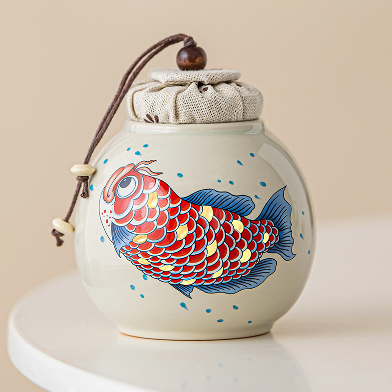 Thùng trà kho báu tròn màu xám thực vật Thùng trà nhỏ lưu trữ cao cấp Jinyu Mantang Thùng trà cầm tay Thùng kín Hộp trà Thùng trà