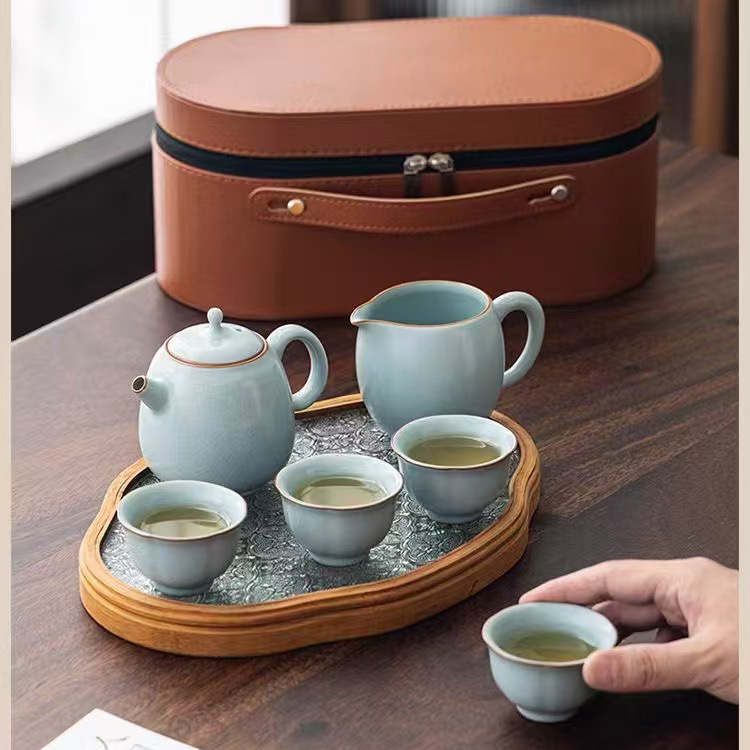 Bộ ấm trà Ru Kiln mở ra có thể nâng ấm trà sứ Ru kiểu Trung Quốc mới, một ấm bốn cốc, bộ trà du lịch Kung Fu, quà lưu niệm