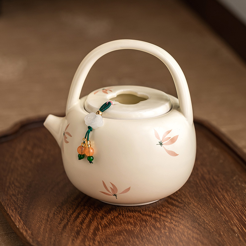 Ấm trà hoa lan tráng men màu vàng ấm trà pha trà gia dụng dung tích lớn ấm trà đơn dụng cụ trà Kung Fu gốm sứ Trung Quốc ấm đun trà