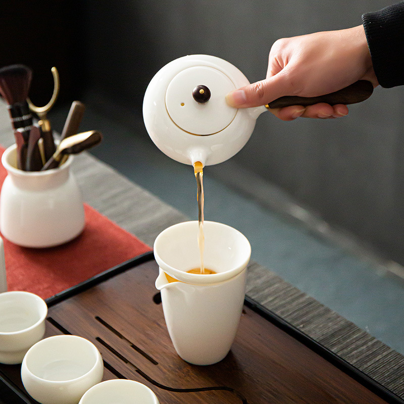 Bộ trà sứ trắng Dehua cao cấp gia dụng đơn giản mỡ cừu ngọc sứ nắp bát sứ trắng tay cầm bên ấm trà cốc sứ bán buôn