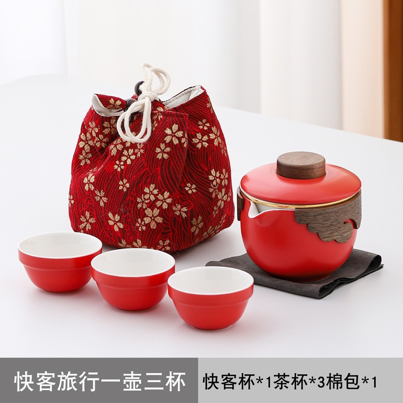 Bộ ấm trà lễ hội màu đỏ gốm sứ du lịch một ấm ba chén ấm trà cầm tay quà lưu niệm sự kiện quà cưới