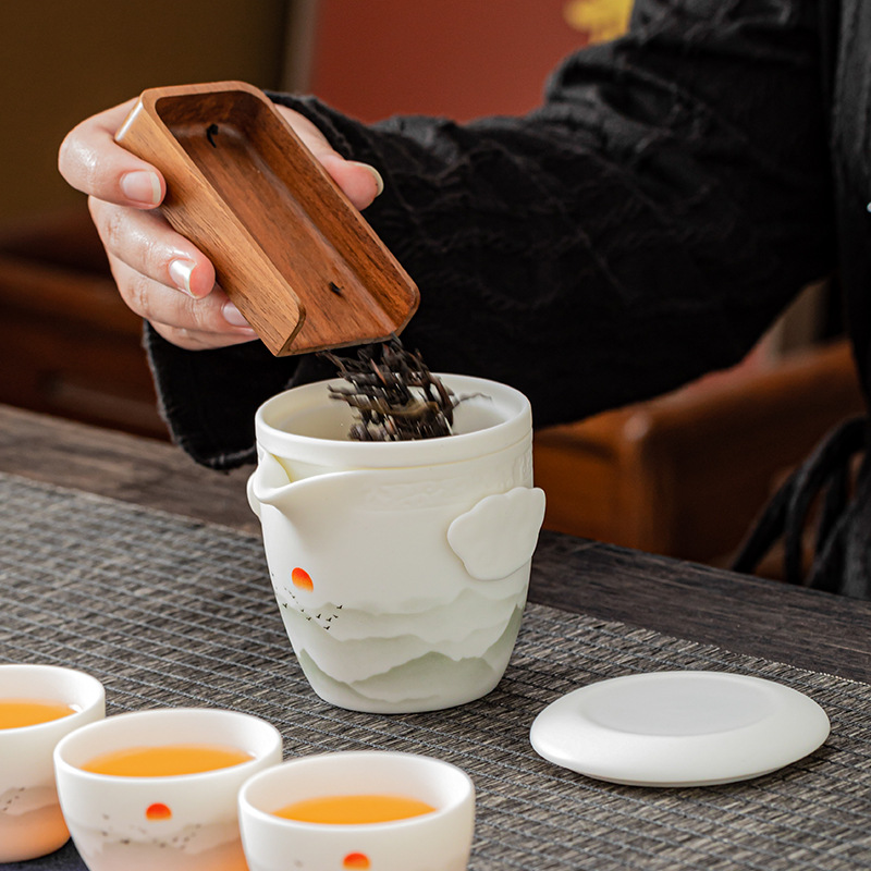 Bộ ấm trà du lịch một ấm bốn cốc gia dụng công ty hàng năm lưu niệm doanh nghiệp ấm trà gốm sứ bán buôn