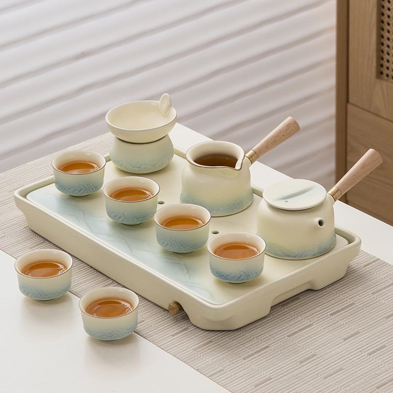 Bộ trà Qianli Jiangshan Bộ trà bàn trà trọn bộ kem phong cách pha trà nắp ấm trà gốm sứ Bộ đồ nữ tinh tế