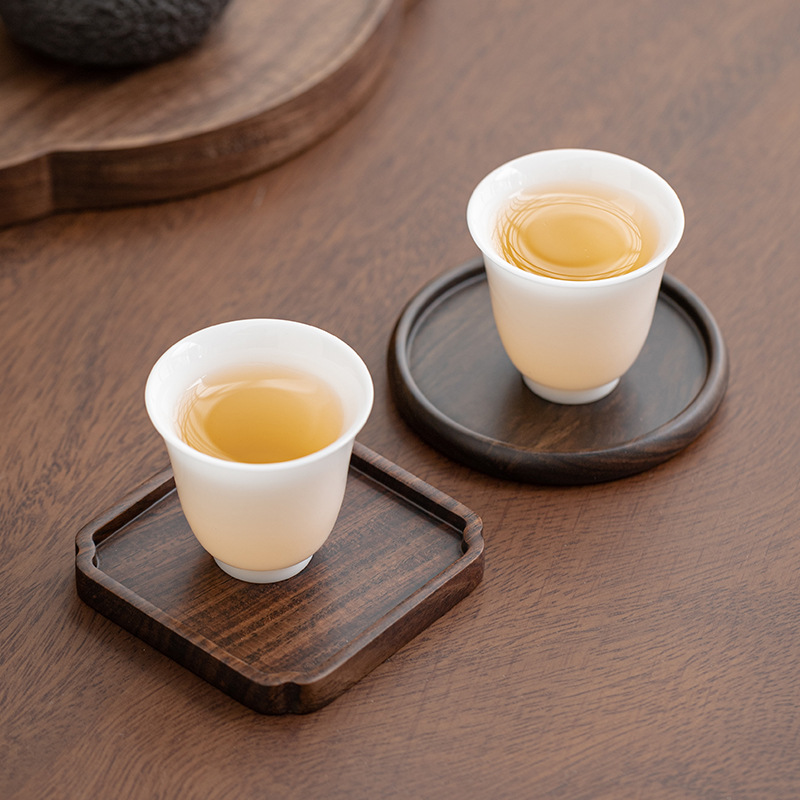 Lót tách trà gỗ solid gỗ mun Lót tách trà Trà đạo Kung Fu Lót tách trà Phụ kiện bộ trà sáng tạo cách nhiệt bằng gỗ