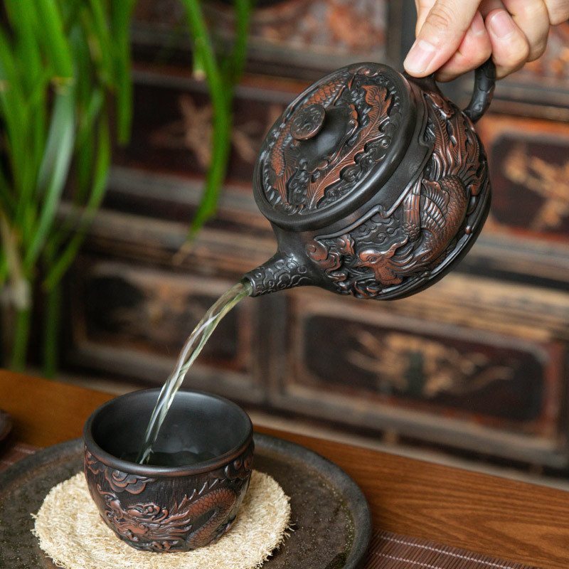 Ấm trà gốm tím ấm trà gốm sứ rồng phượng Hán dụng cụ pha trà Kung Fu gia dụng chạm khắc thủ công dung tích lớn Vân Nam Jianshui