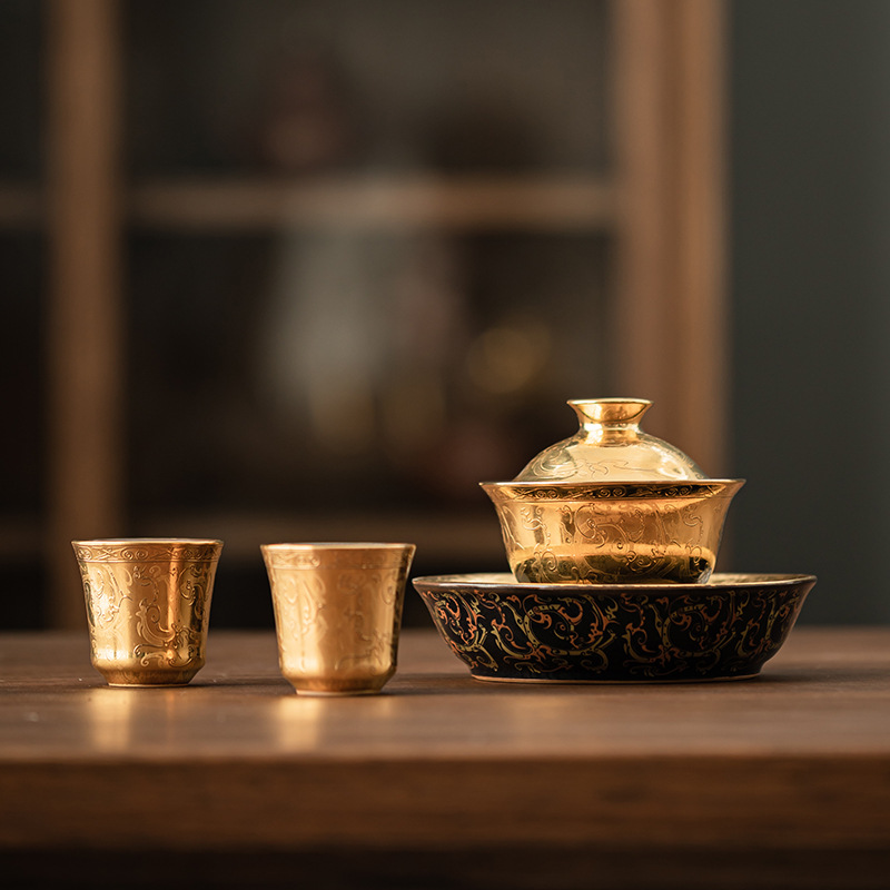 Song Yu mạ vàng hoa văn Chilong một bát hai cốc bộ ấm trà gốm sứ gia dụng nắp cốc trà bộ trà hộp quà tặng