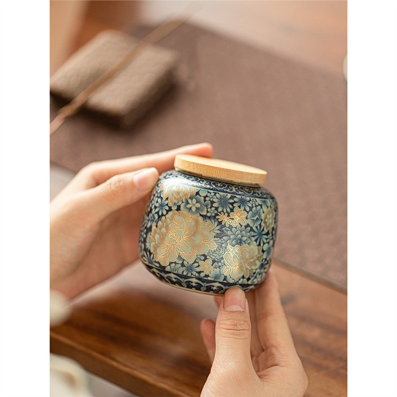 Bình đựng trà hoa Ruyao Bình đựng trà Pu'er nhỏ gia dụng Bình đựng trà gốm sứ cao cấp cầm tay ngoài trời
