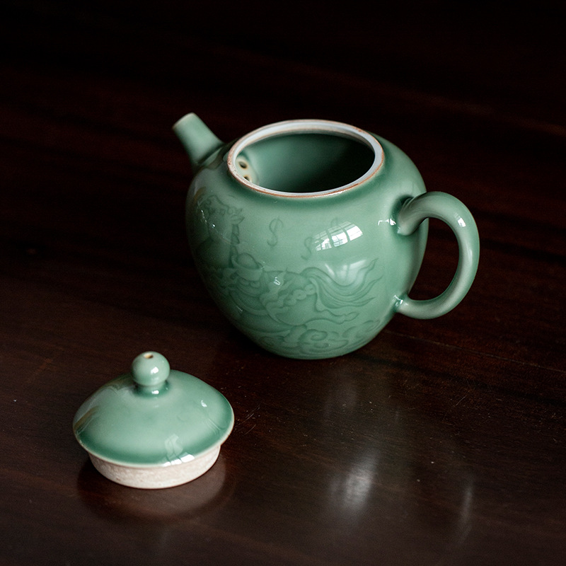 Ấm trà gốm sứ chạm khắc bóng men ngọc sang trọng nhẹ cao cấp ấm trà xanh Pu'er dung tích lớn nhỏ gia dụng ấm đơn Bộ trà Kung Fu