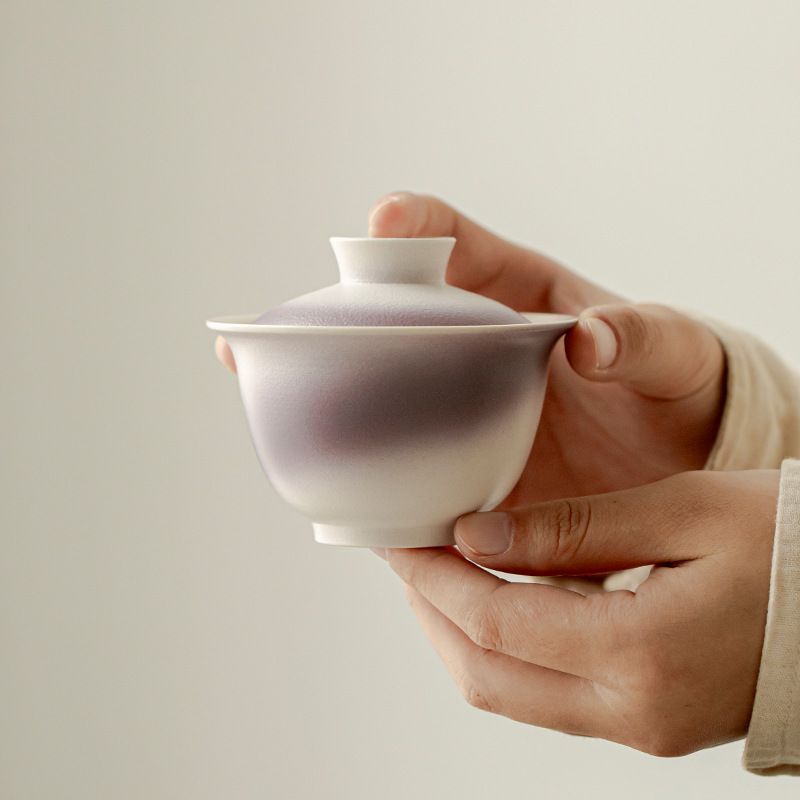Bộ trà du lịch gốm sứ Chupu một ấm hai cốc ngoài trời đựng túi vải lưu trữ quà lưu niệm sáng tạo kiểu Trung Quốc