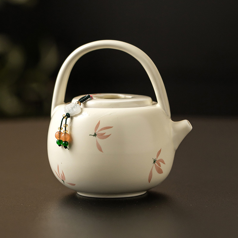 Ấm trà hoa lan tráng men màu vàng ấm trà pha trà gia dụng dung tích lớn ấm trà đơn dụng cụ trà Kung Fu gốm sứ Trung Quốc ấm đun trà