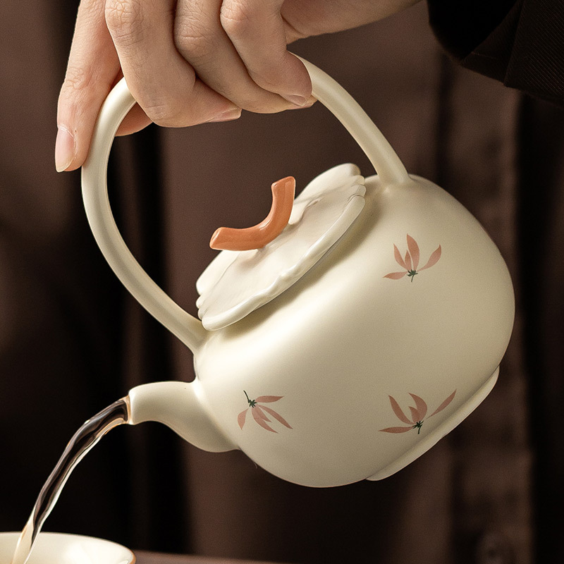 Ấm trà hoa lan tráng men màu vàng ấm trà ấm trà dụng cụ trà Kung Fu gốm sứ gia dụng ấm trà pha trà dung tích lớn cao cấp