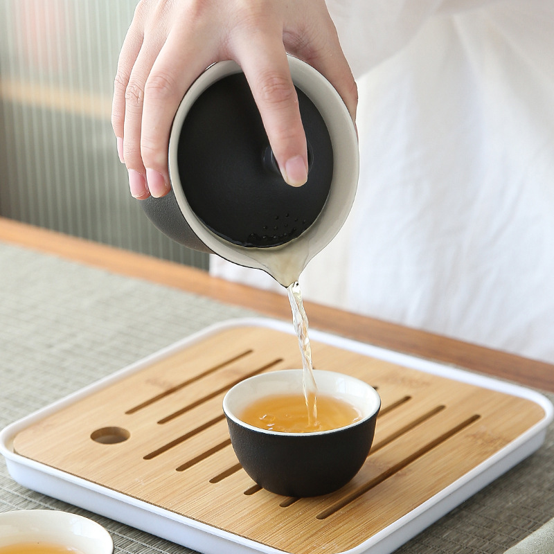 Bộ trà sóng biển gốm thô Bộ một ấm Ba cốc đựng đồ xách tay ngoài trời dụng cụ pha trà đơn giản Bộ trà Kung Fu gốm sứ