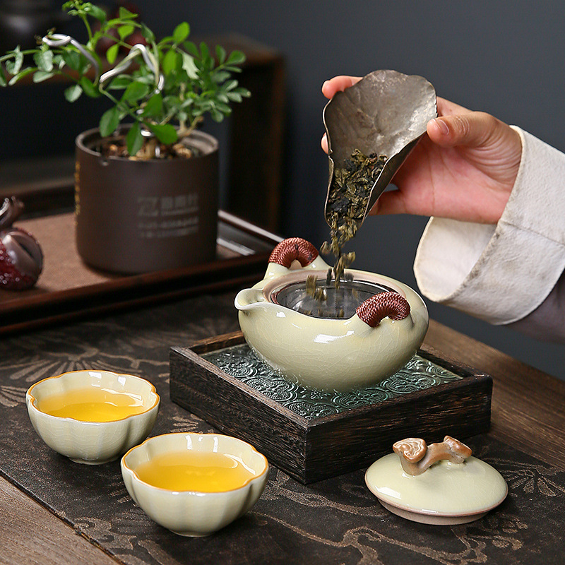 Bộ trà du lịch Ruyao cốc khách nhanh đơn giản cao cấp cầm tay pha trà ngoài trời một bình hai cốc bộ bốn cốc