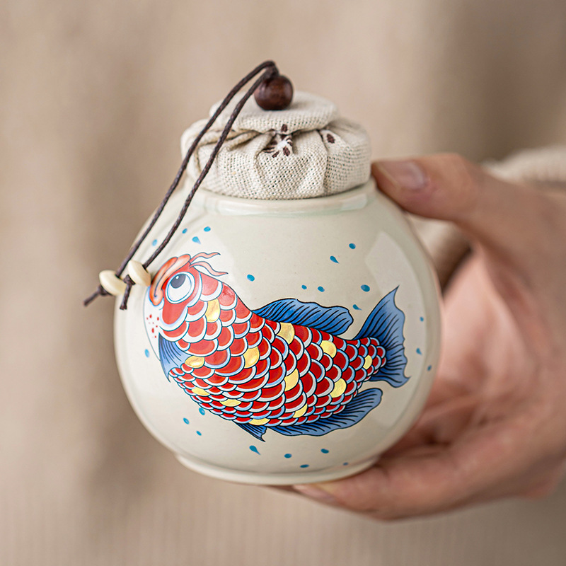 Thùng trà kho báu tròn màu xám thực vật Thùng trà nhỏ lưu trữ cao cấp Jinyu Mantang Thùng trà cầm tay Thùng kín Hộp trà Thùng trà