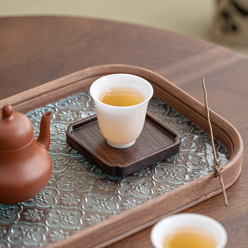 Lót tách trà gỗ solid gỗ mun Lót tách trà Trà đạo Kung Fu Lót tách trà Phụ kiện bộ trà sáng tạo cách nhiệt bằng gỗ