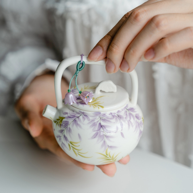 Ấm trà cầm xà nghiêng hoa tử đằng vẽ tay tinh khiết ấm trà gốm sứ ấm trà pha trà chuyên dụng gia dụng có dây xách tay