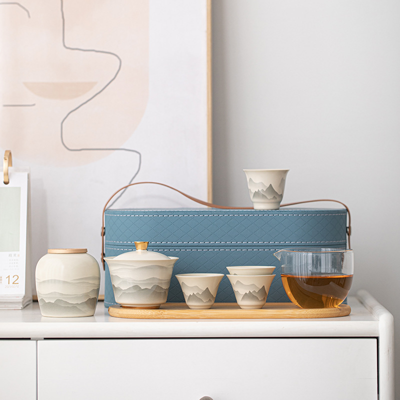 Bộ trà du lịch đựng gốm sứ cầm tay cốc khách nhanh một ấm bốn cốc cắm trại ngoài trời cốc trà Kung Fu ấm pha trà