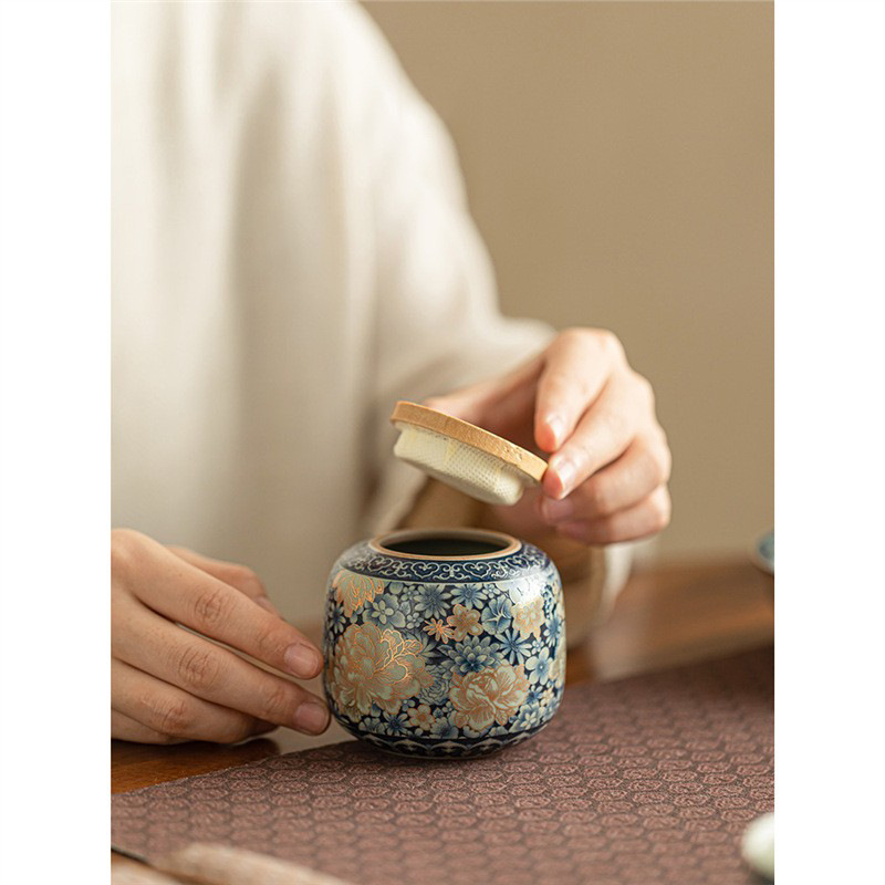 Bình đựng trà hoa Ruyao Bình đựng trà Pu'er nhỏ gia dụng Bình đựng trà gốm sứ cao cấp cầm tay ngoài trời