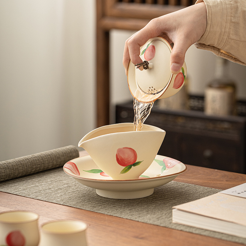 Bộ trà màu vàng kem đào vẽ tay dụng cụ trà Kung Fu sáng tạo gốm sứ gia dụng dễ thương bát trà cốc trà