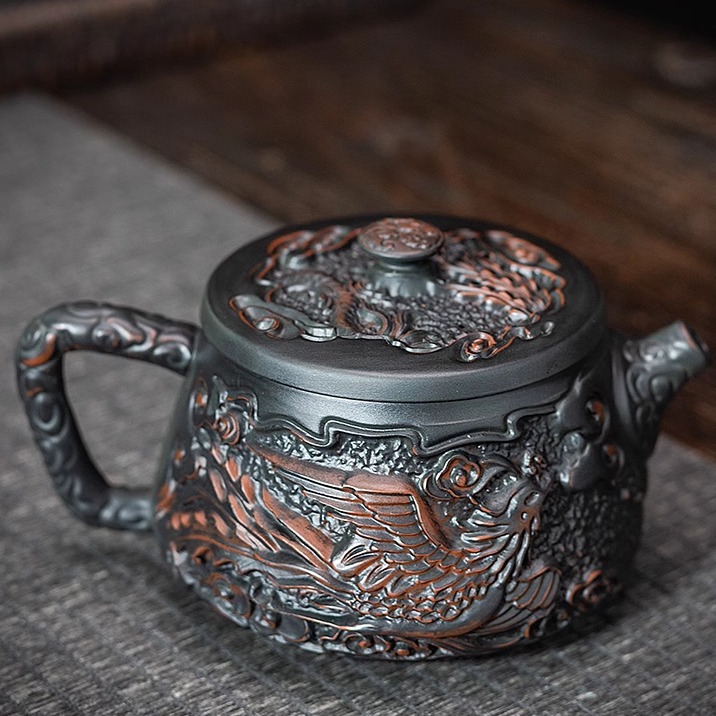 Ấm trà Fengming bằng gốm tím ấm đơn ấm đất sét màu tím nước xây nổi thủ công ấm trà cao cấp Xishi dụng cụ trà Kung Fu ấm cầm tay