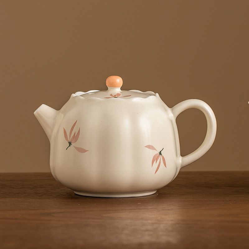 Ấm trà nụ hoa lan tráng men màu vàng gạo ấm trà gia dụng dụng dụng cụ trà gốm sứ kiểu Trung Quốc dung tích lớn ấm trà Kung Fu cầm tay cầm