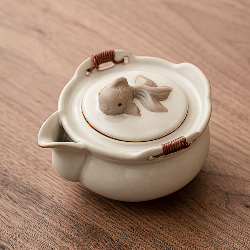 Ấm cầm tay Ru Kiln màu vàng be ấm pha trà gốm sứ cao cấp một bộ trà Kung Fu gia dụng chống bỏng ấm đơn có nắp