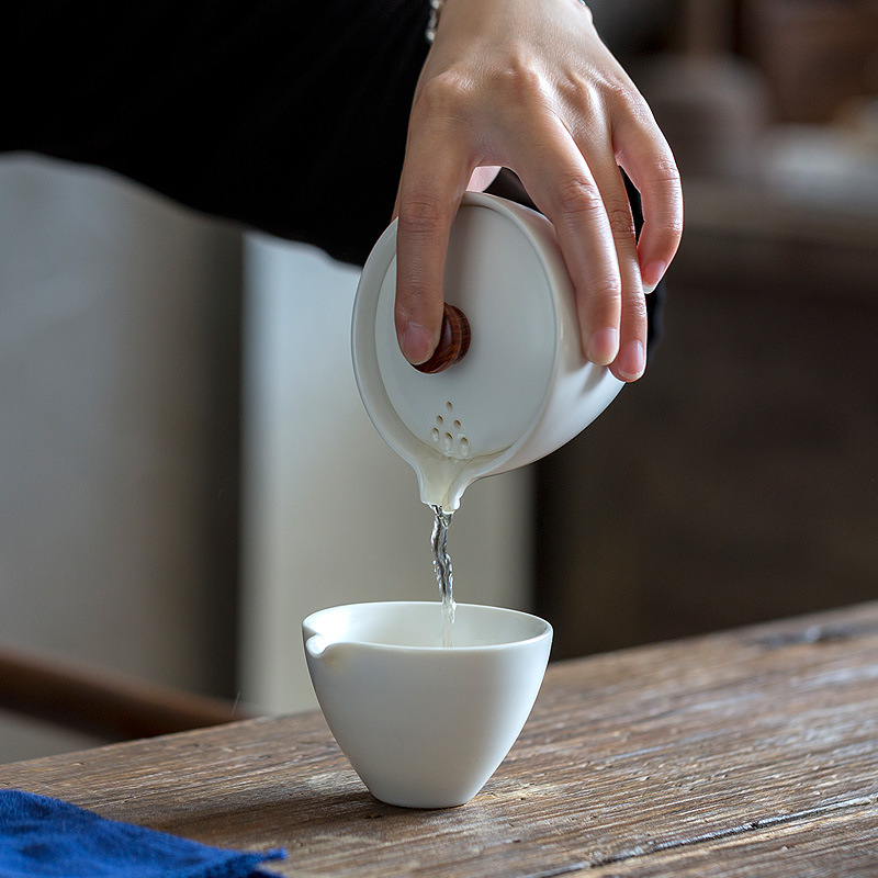 Bộ trà du lịch di động cốc khách nhanh bằng gốm Sứ đơn giản gia dụng nhỏ một ấm Ba cốc Túi xách ngoài trời trên xe