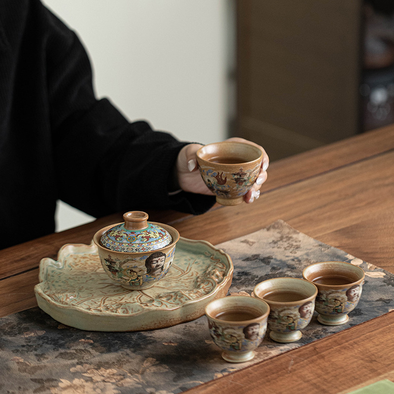 Bộ trà du lịch tượng Phật Đôn Hoàng một ấm bốn cốc du lịch ngoài trời di động Bộ trà Kung Fu gốm sứ gia dụng