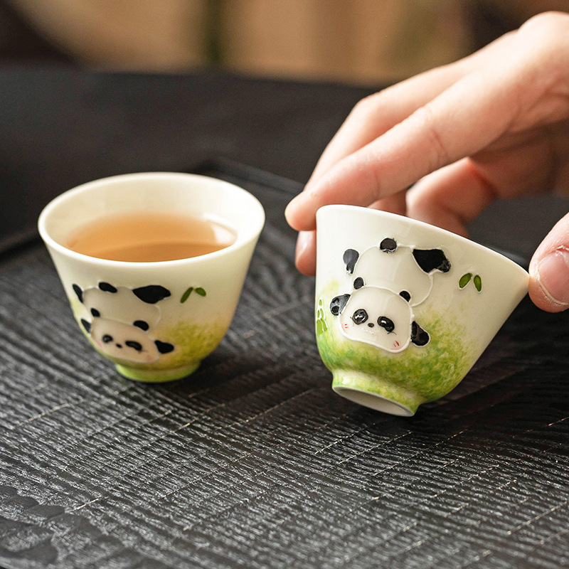 Cốc trà gốm sứ vẽ tay đống gấu trúc chạm khắc Ruyi cốc dụng cụ trà gia dụng sáng tạo cốc trà cốc trà cốc chủ nhân