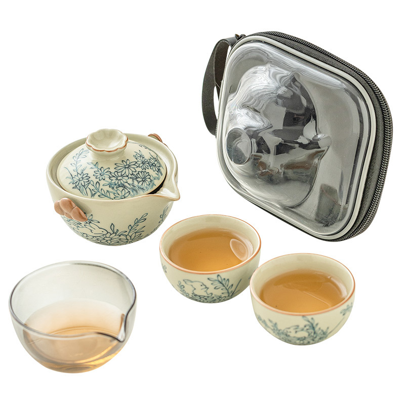 Hoa hướng dương Mengtu Ru lò một bình hai cốc bộ ấm trà du lịch ngoài trời di động ấm trà gốm sứ kiểu Trung Quốc