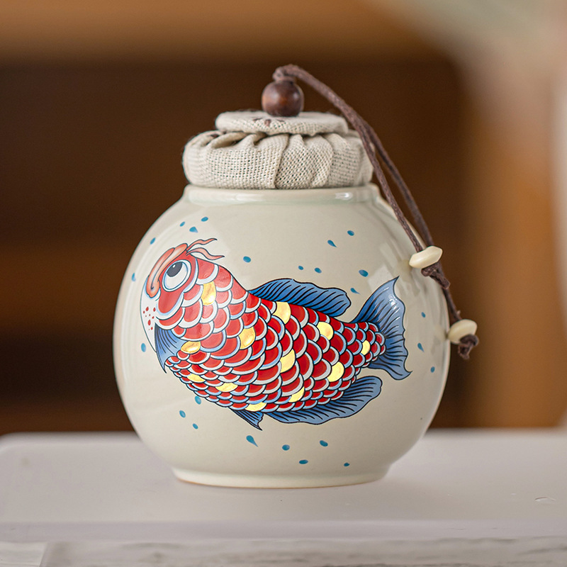 Thùng trà kho báu tròn màu xám thực vật Thùng trà nhỏ lưu trữ cao cấp Jinyu Mantang Thùng trà cầm tay Thùng kín Hộp trà Thùng trà