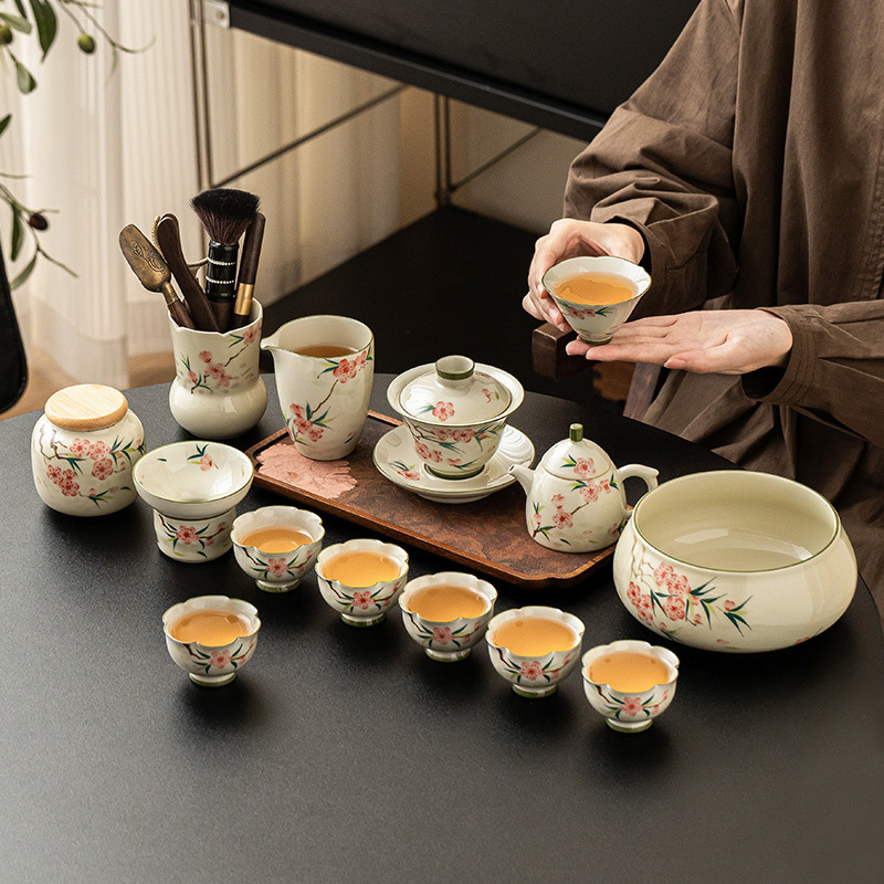 Bộ ấm chén trà hoa đào vẽ tay mẫu mới 2025 dùng cho nhà và văn phòng, chất liệu gốm sứ