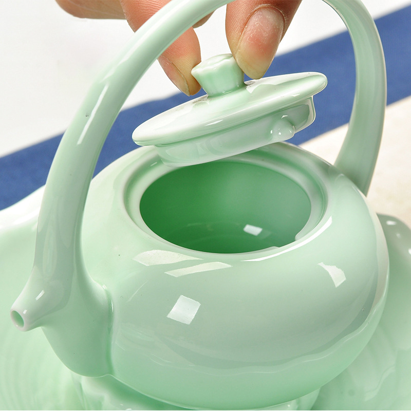 Dụng cụ trà gốm sứ Yingqing nhỏ cầm xà một ấm bốn cốc gia dụng gia dụng quà tặng gia dụng ấm trà văn phòng bộ hộp quà