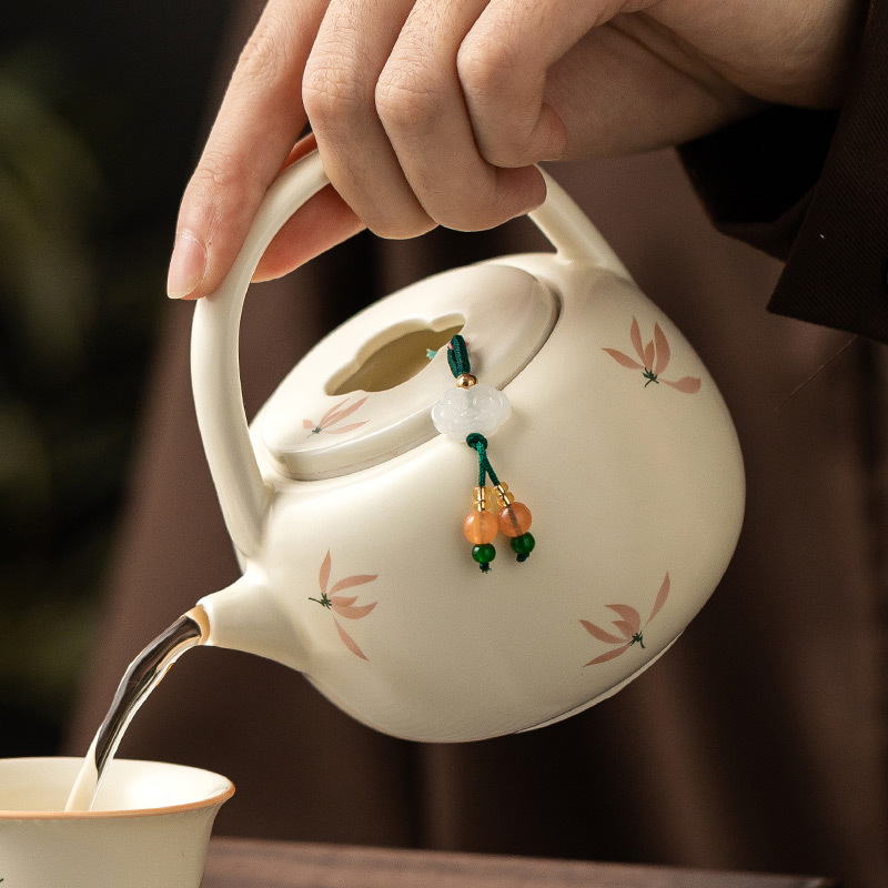 Ấm trà hoa lan tráng men màu vàng ấm trà pha trà gia dụng dung tích lớn ấm trà đơn dụng cụ trà Kung Fu gốm sứ Trung Quốc ấm đun trà