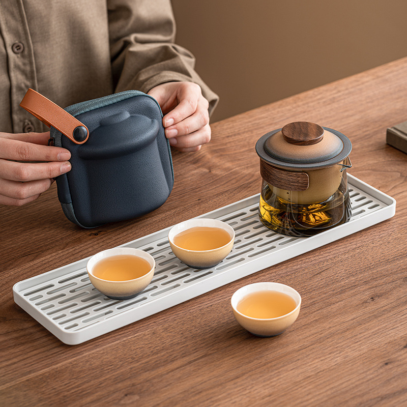 Bộ trà du lịch Rizhao Jinshan Bộ thiết bị pha trà di động cắm trại ngoài trời cốc khách nhanh di động một ấm Ba cốc
