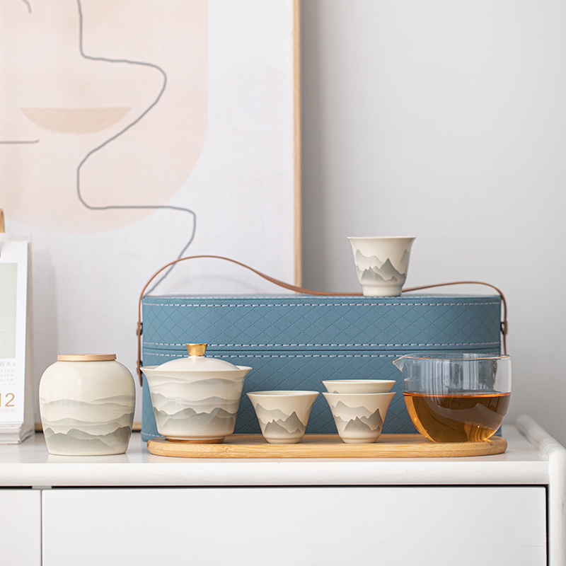 Bộ trà du lịch đựng gốm sứ cầm tay cốc khách nhanh một ấm bốn cốc cắm trại ngoài trời cốc trà Kung Fu ấm pha trà