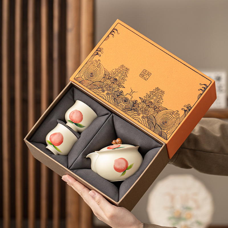 Màu hồng vẽ tay gốm sứ màu be nước đào nắm tay ấm chén cá nhân bộ trà Kung Fu bộ quà tặng bán buôn