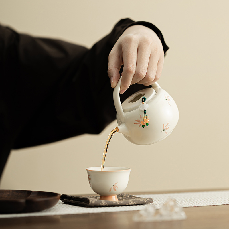 Phong lan chuông gió màu be vàng Ding lò nung chùm ấm pha trà cầm tay gốm sứ dụng cụ pha trà Kung Fu dụng cụ pha trà lỗ bóng dụng cụ pha trà