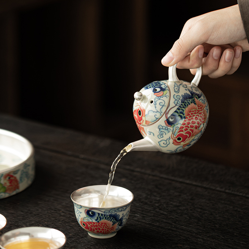 Bộ ấm trà Kung Fu gốm sứ một ấm ba chén cá rồng bạc bạc gia dụng tặng quà cho lãnh đạo và khách hàng