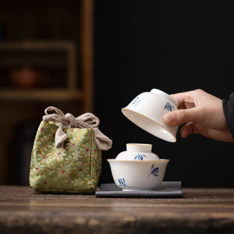 Có nắp bát tinh khiết vẽ tay bướm hoa lan gốm sứ bộ trà kungfu cốc khách nhanh cốc uống trà một người di động ngoài trời