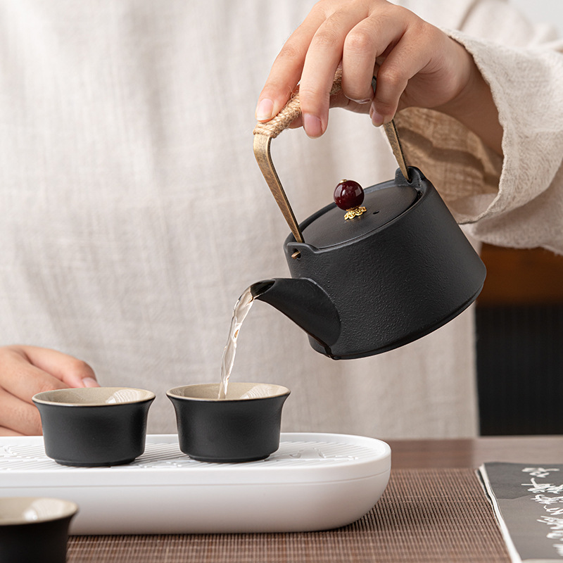 Bộ ấm trà du lịch Nhật Bản, cốc khách nhanh xách tay ngoài trời, một ấm bốn cốc, dụng cụ pha trà gốm sứ, bán buôn quà tặng