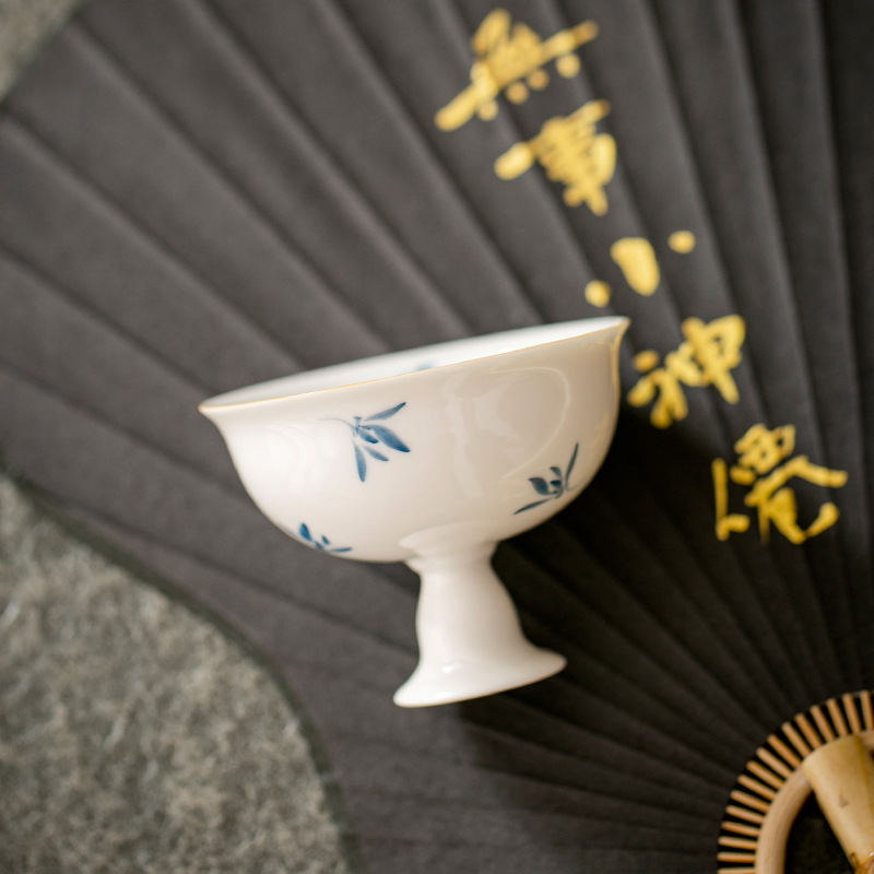 Cốc trà vẽ tay tinh khiết Dehua lan hồ điệp hoa công phu bộ trà chủ cốc đơn sứ trắng sản phẩm gia dụng cốc trà bán buôn