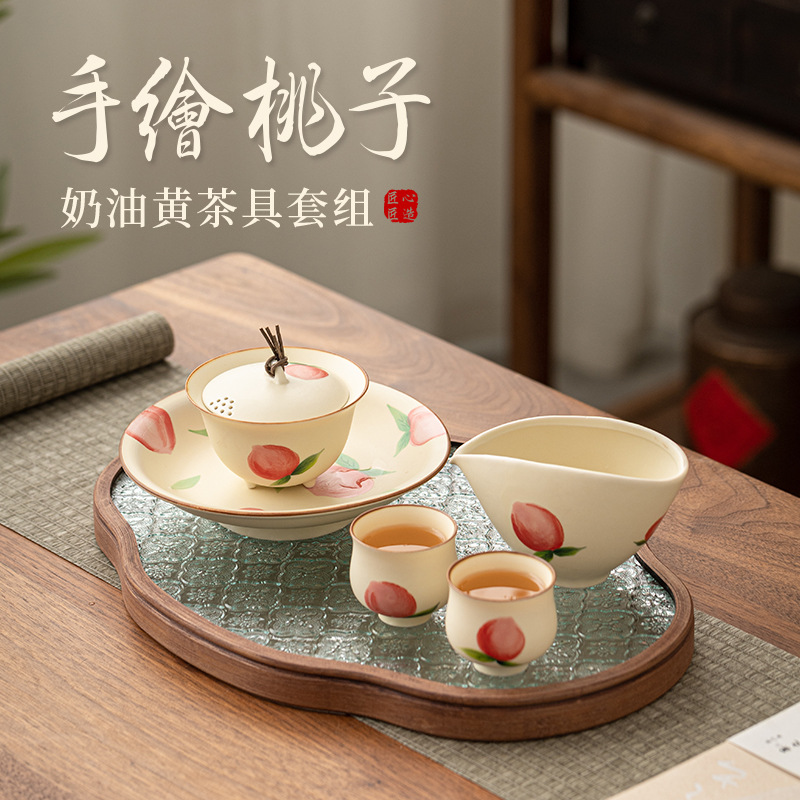 Bộ trà màu vàng kem đào vẽ tay dụng cụ trà Kung Fu sáng tạo gốm sứ gia dụng dễ thương bát trà cốc trà