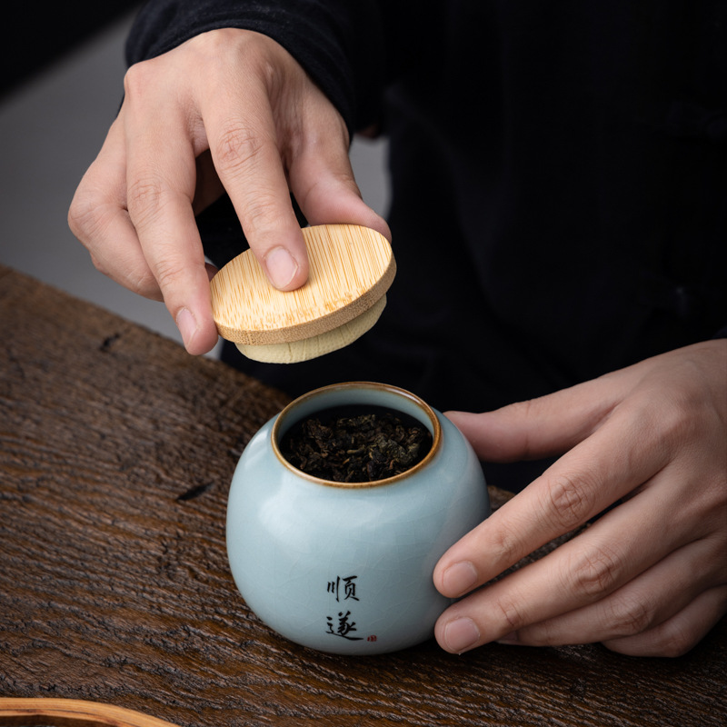 Hộp đựng trà gốm sứ nhỏ Tianqingru lò mở miếng kín hộp đựng trà gia dụng hộp đựng trà xanh trà Pu'er