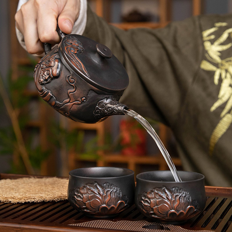 Ấm trà gốm tím Hanwa có thể nâng và xoay ấm trà đất sét tím Dama nước xây thủ công Bộ ấm trà Kung Fu gia dụng