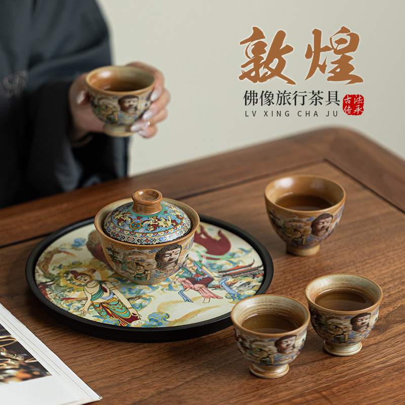 Bộ trà du lịch tượng Phật Đôn Hoàng một ấm bốn cốc du lịch ngoài trời di động Bộ trà Kung Fu gốm sứ gia dụng