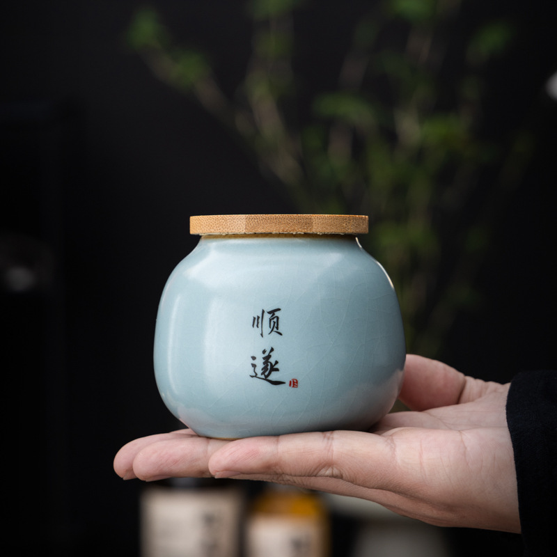 Hộp đựng trà gốm sứ nhỏ Tianqingru lò mở miếng kín hộp đựng trà gia dụng hộp đựng trà xanh trà Pu'er