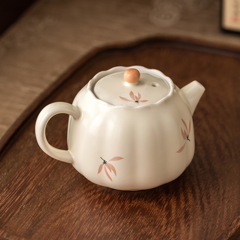 Ấm trà nụ hoa lan tráng men màu vàng gạo ấm trà gia dụng dụng dụng cụ trà gốm sứ kiểu Trung Quốc dung tích lớn ấm trà Kung Fu cầm tay cầm