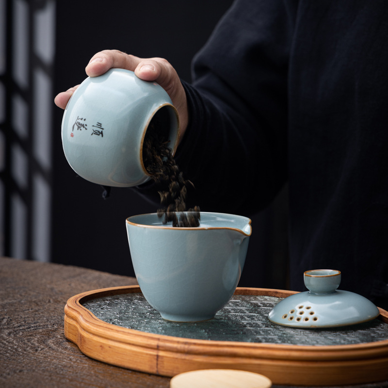 Hộp đựng trà gốm sứ nhỏ Tianqingru lò mở miếng kín hộp đựng trà gia dụng hộp đựng trà xanh trà Pu'er