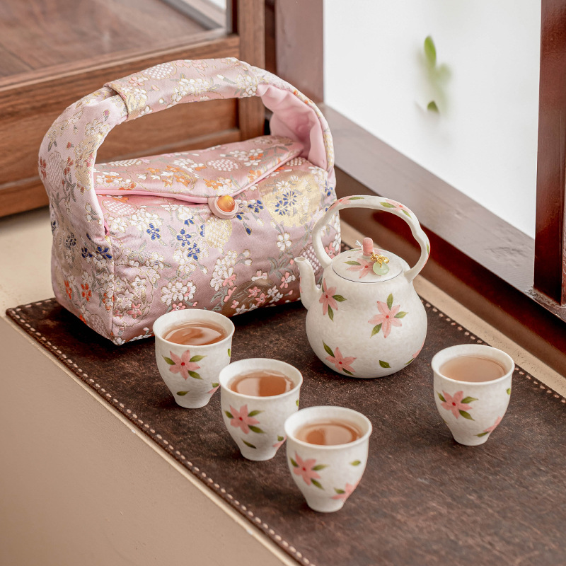 Bộ dụng cụ pha trà kungfu hoa anh đào trắng đá mỏ ấm trà cầm tay ngoài trời cốc pha trà gốm sứ ấm một ấm bốn cốc